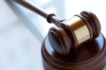 Wooden judge gavel representing legal authority and professional courtroom proceedings